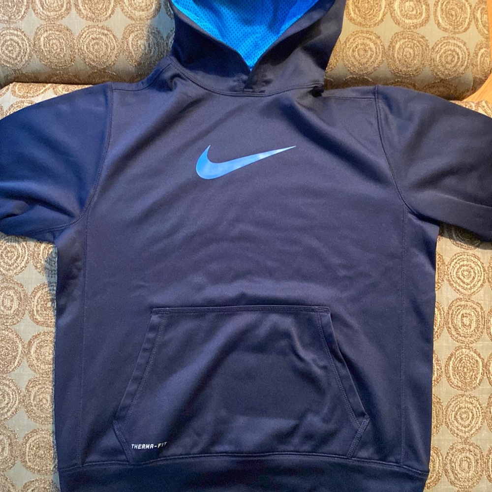 Navy blue Nike hoodie with light blue Nike swoosh and hoodie. Big boys size L